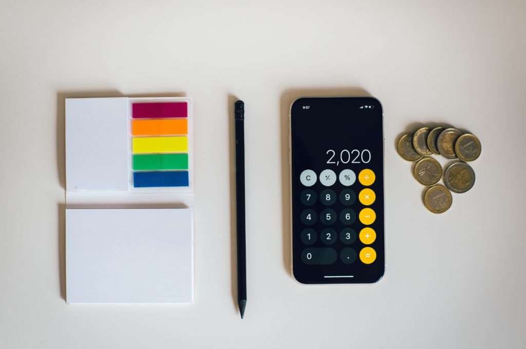 Sticky notes, pens, iPhone calculator for calculating taxes