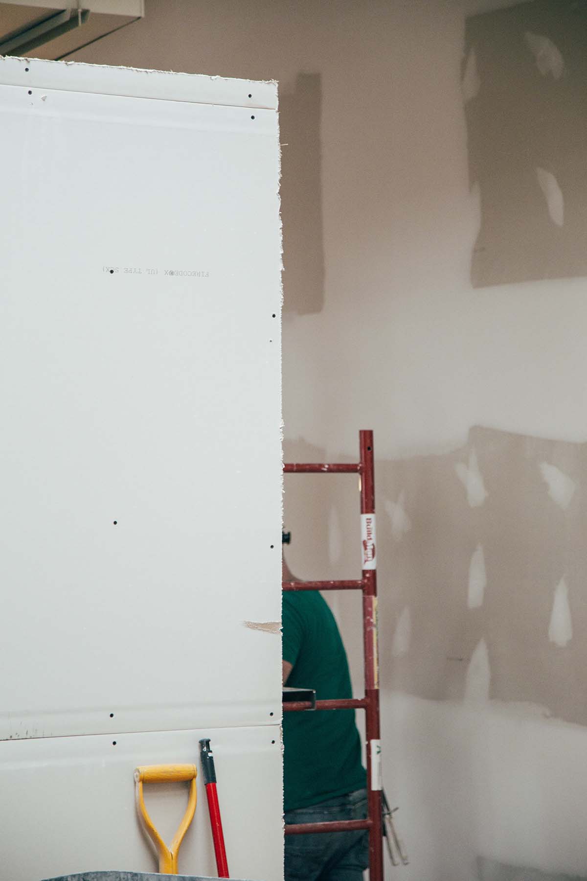 Fresh drywall and paint on a home renovation.